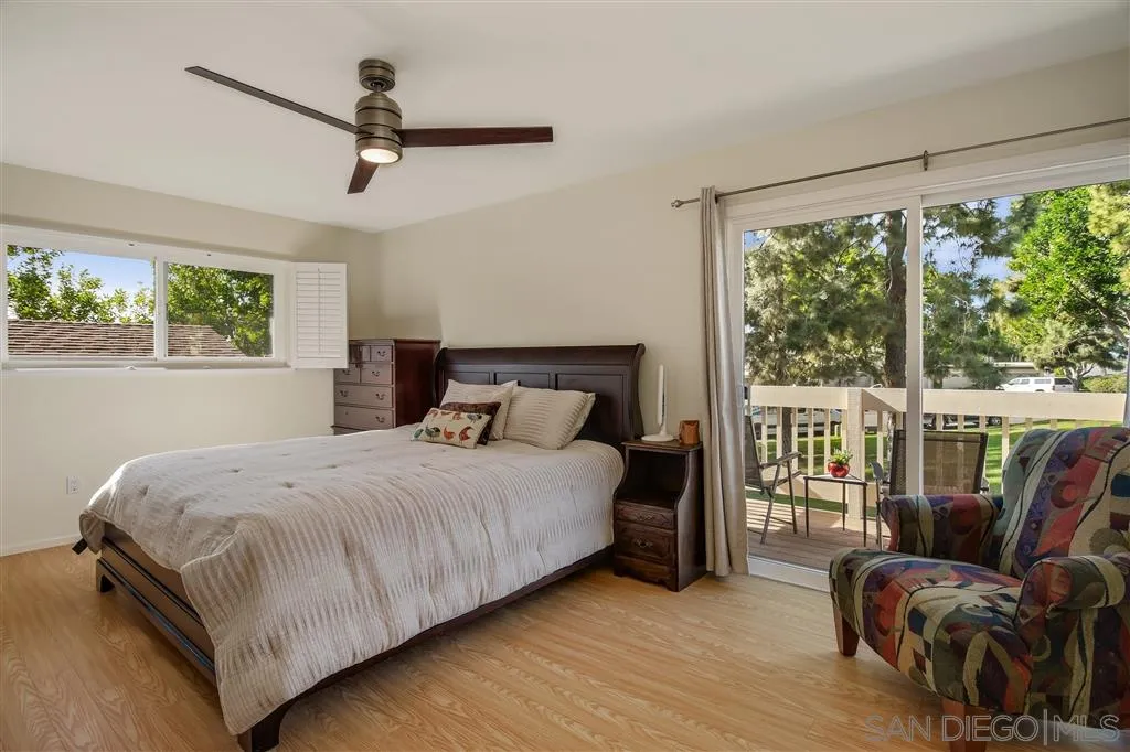 210 Countryhaven Road Encinitas, CA 92024 - Photo 12 of 25 a bedroom with a bed and a large window