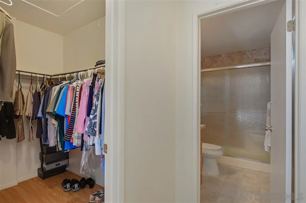 210 Countryhaven Road Encinitas, CA 92024 - Photo 17 of 25 a view of walk in closet with clothes and shoes
