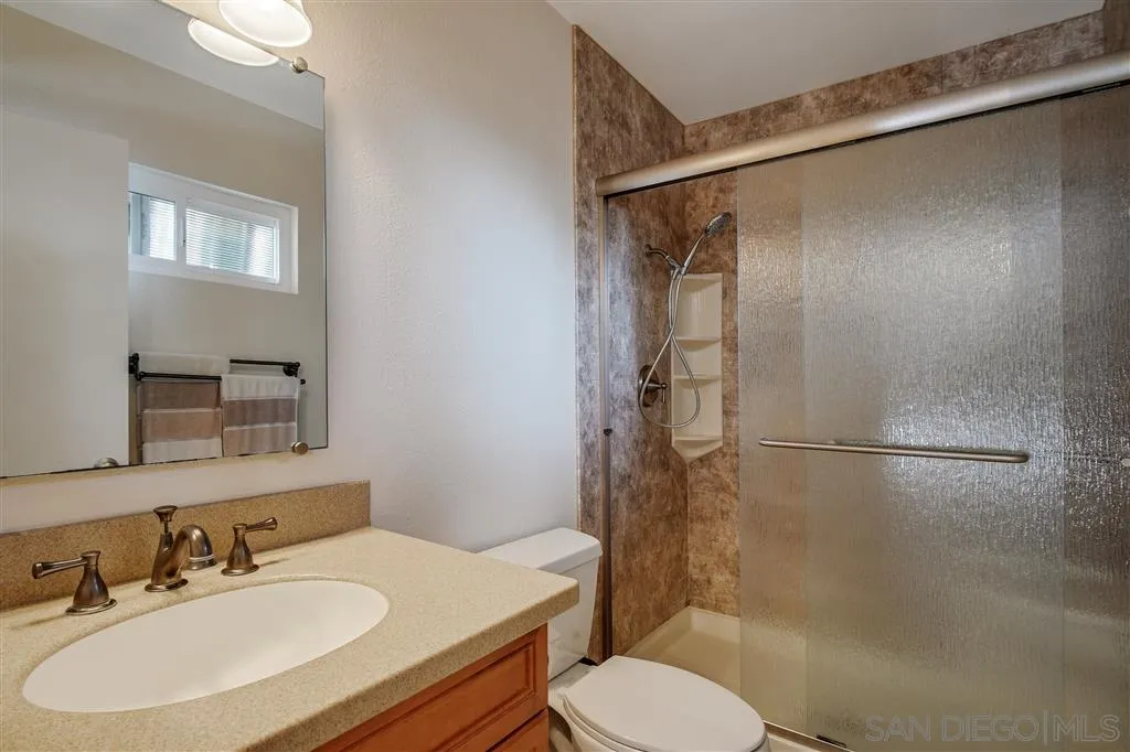 210 Countryhaven Road Encinitas, CA 92024 - Photo 18 of 25 a bathroom with a sink toilet and shower