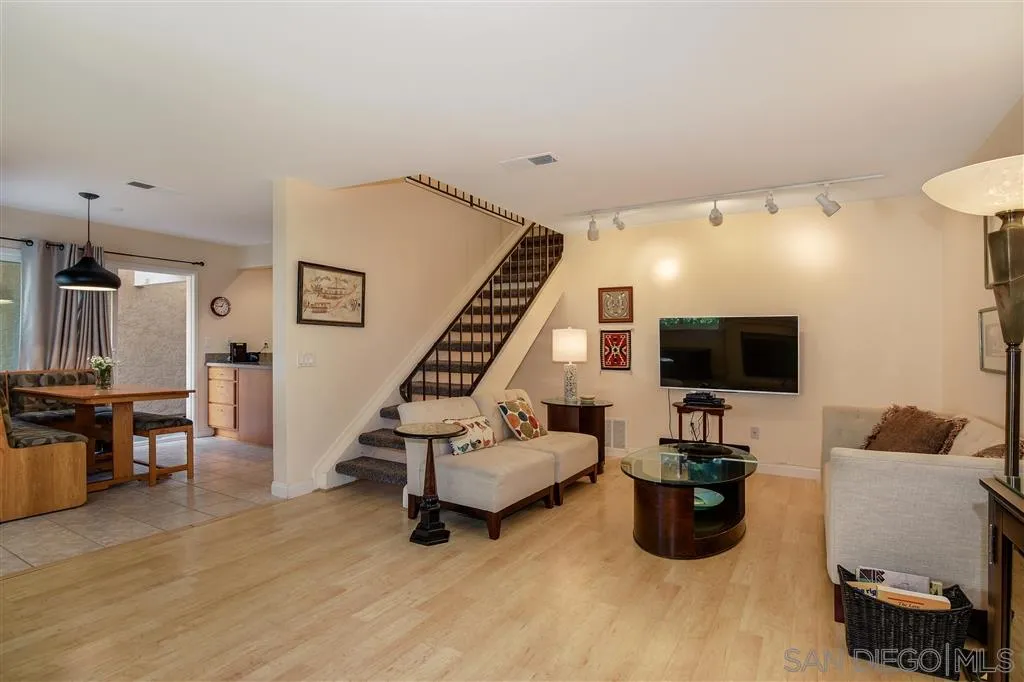 210 Countryhaven Road Encinitas, CA 92024 - Photo 4 of 25 a living room with furniture and a flat screen tv