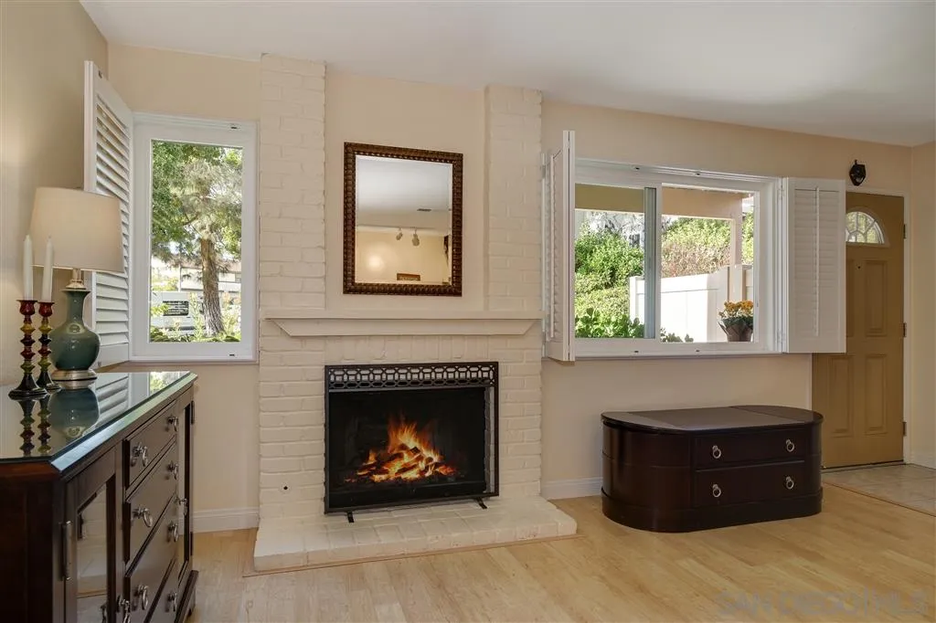 210 Countryhaven Road Encinitas, CA 92024 - Photo 6 of 25 a living room with furniture and a fireplace