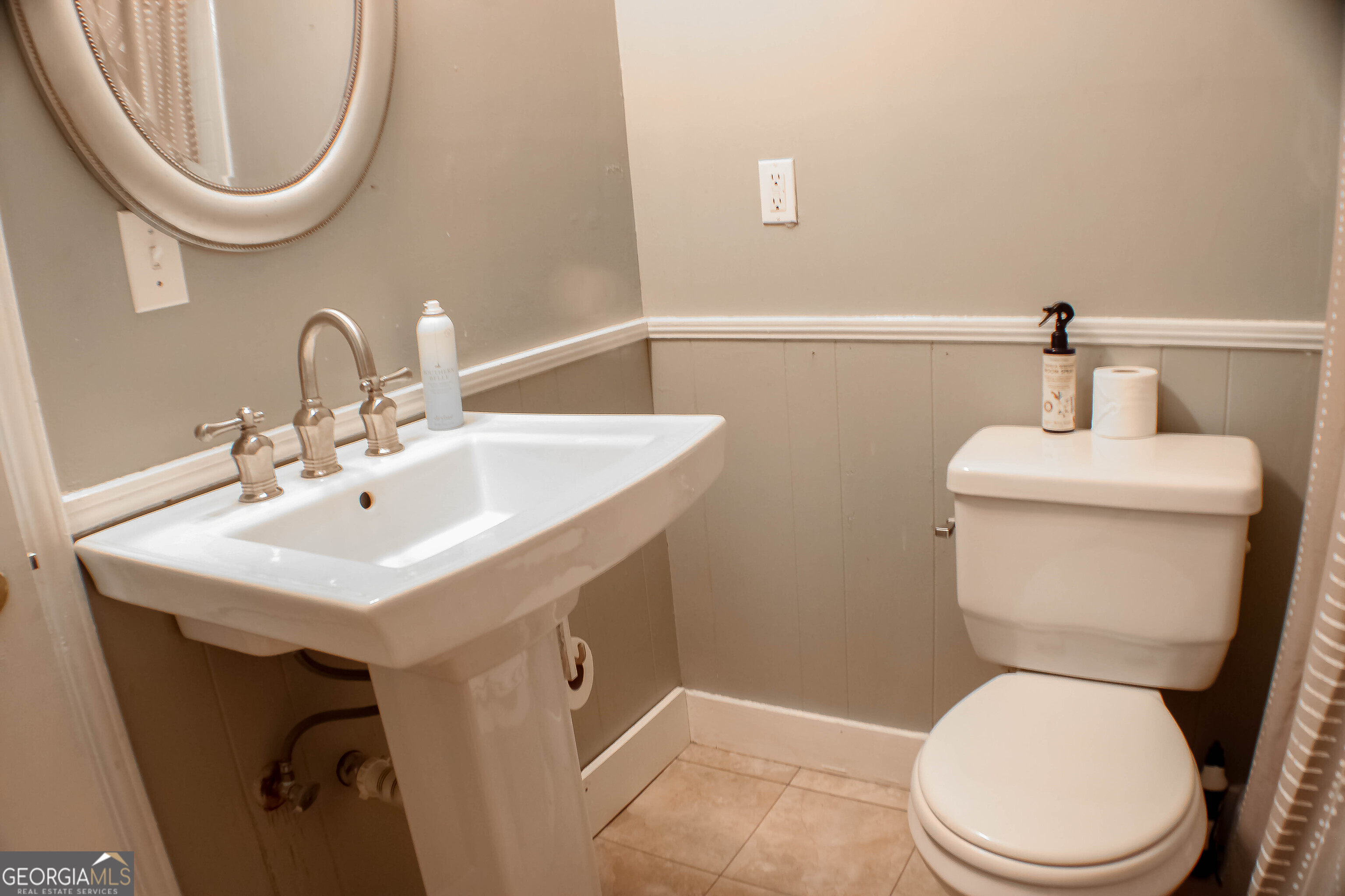 311 Roswell Avenue Southeast Rome, GA 30161 - Photo 11 of 21 a bathroom with a toilet a sink and a mirror