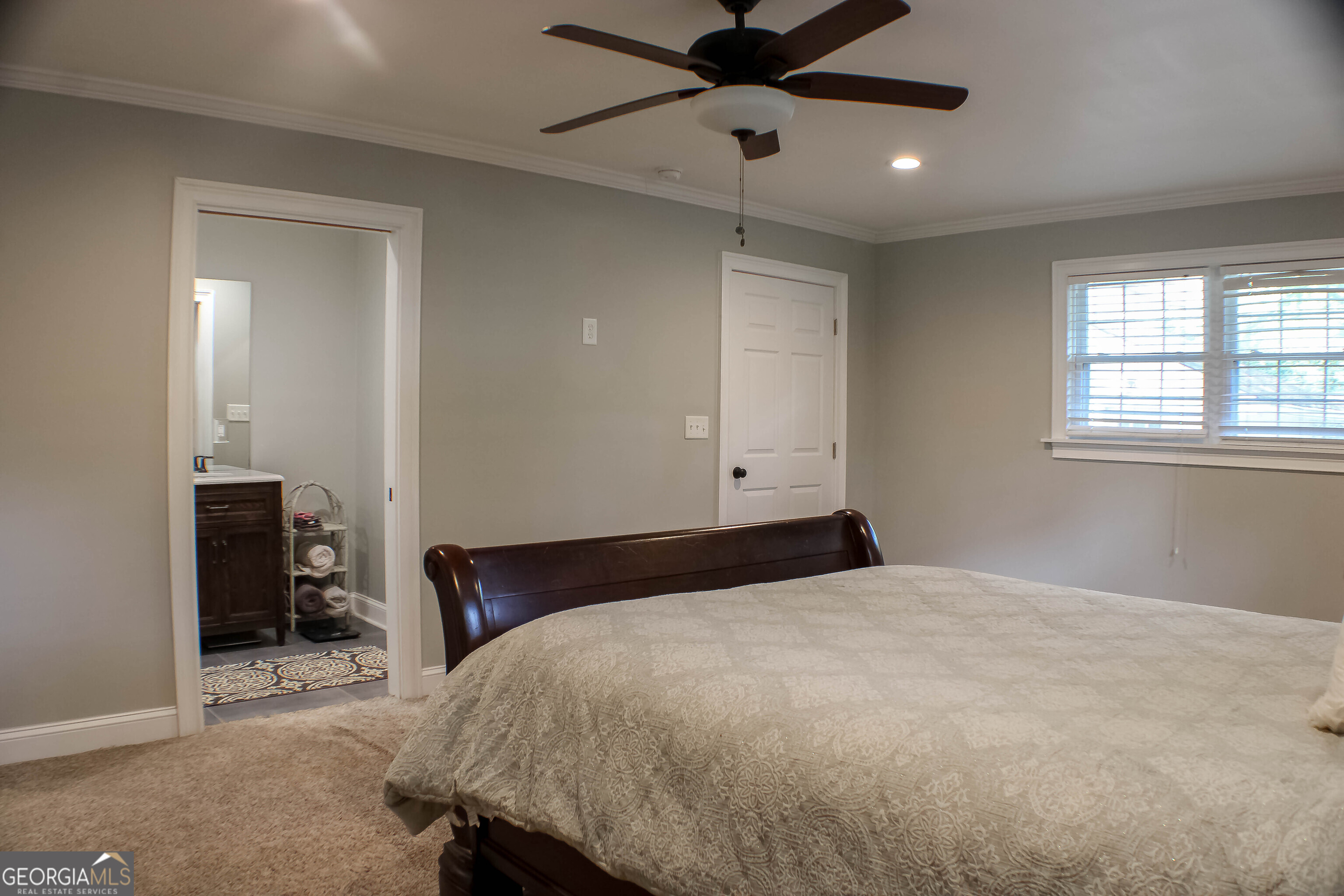 311 Roswell Avenue Southeast Rome, GA 30161 - Photo 16 of 21 a bedroom with a bed and a chandelier