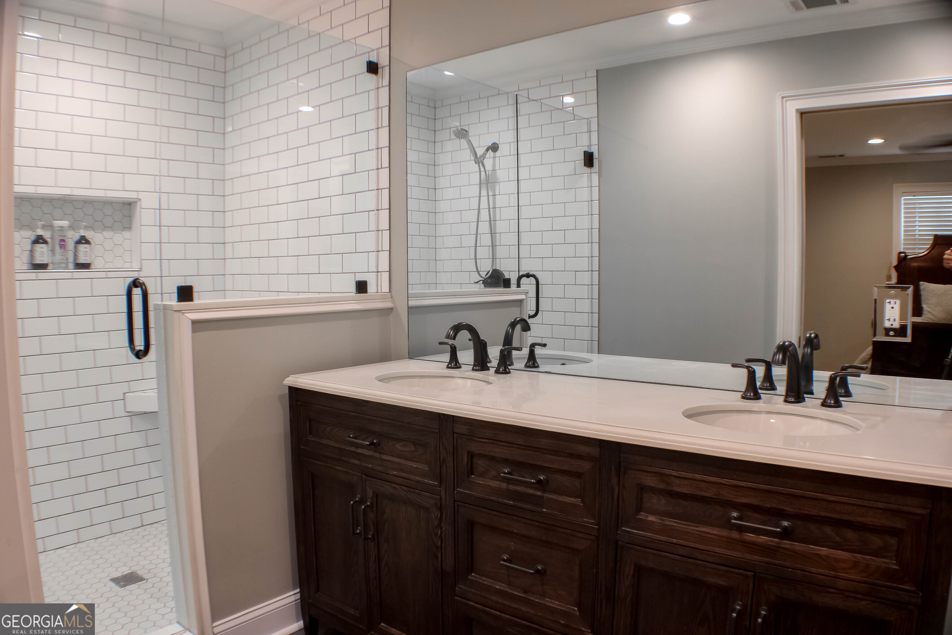 311 Roswell Avenue Southeast Rome, GA 30161 - Photo 17 of 21 a bathroom with a sink double vanity and a mirror