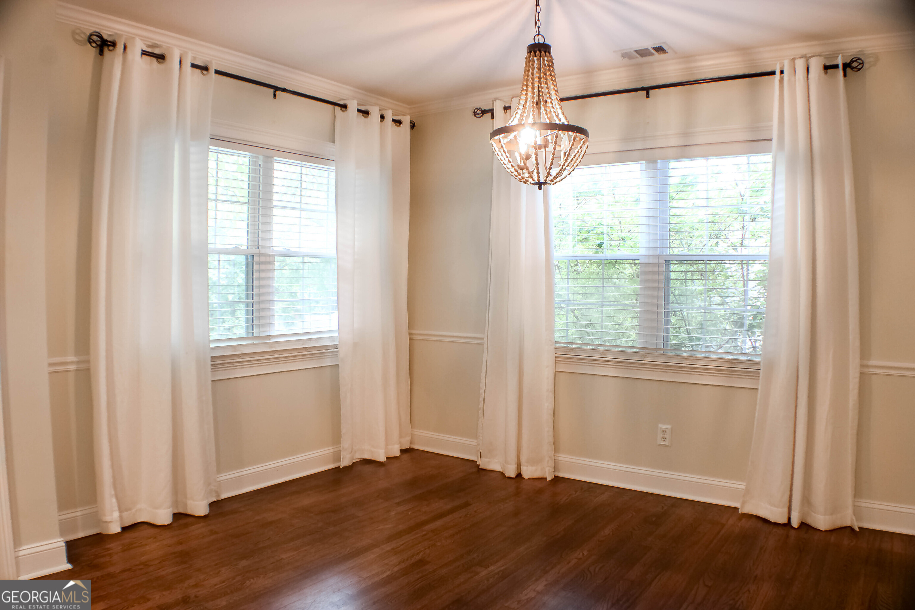 311 Roswell Avenue Southeast Rome, GA 30161 - Photo 6 of 21 a view of empty room with wooden floor and fan