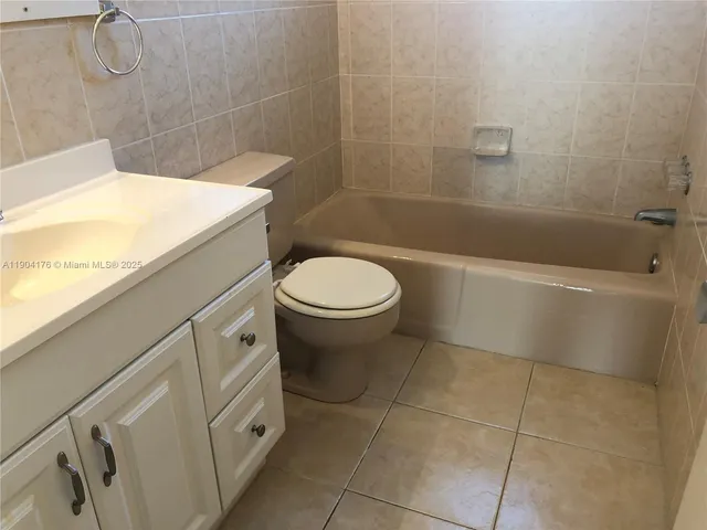 a bedroom with a bed and dresser