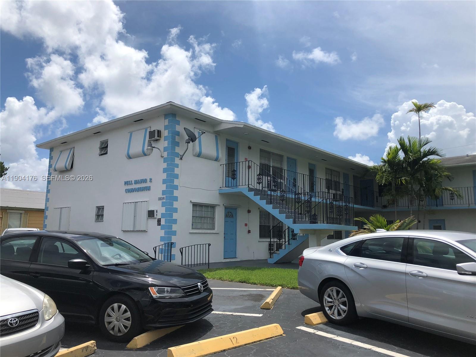 1836 Arthur Street, Unit 20 Hollywood, FL 33020 - Photo 2 of 19 a view of a car parked in front of a house