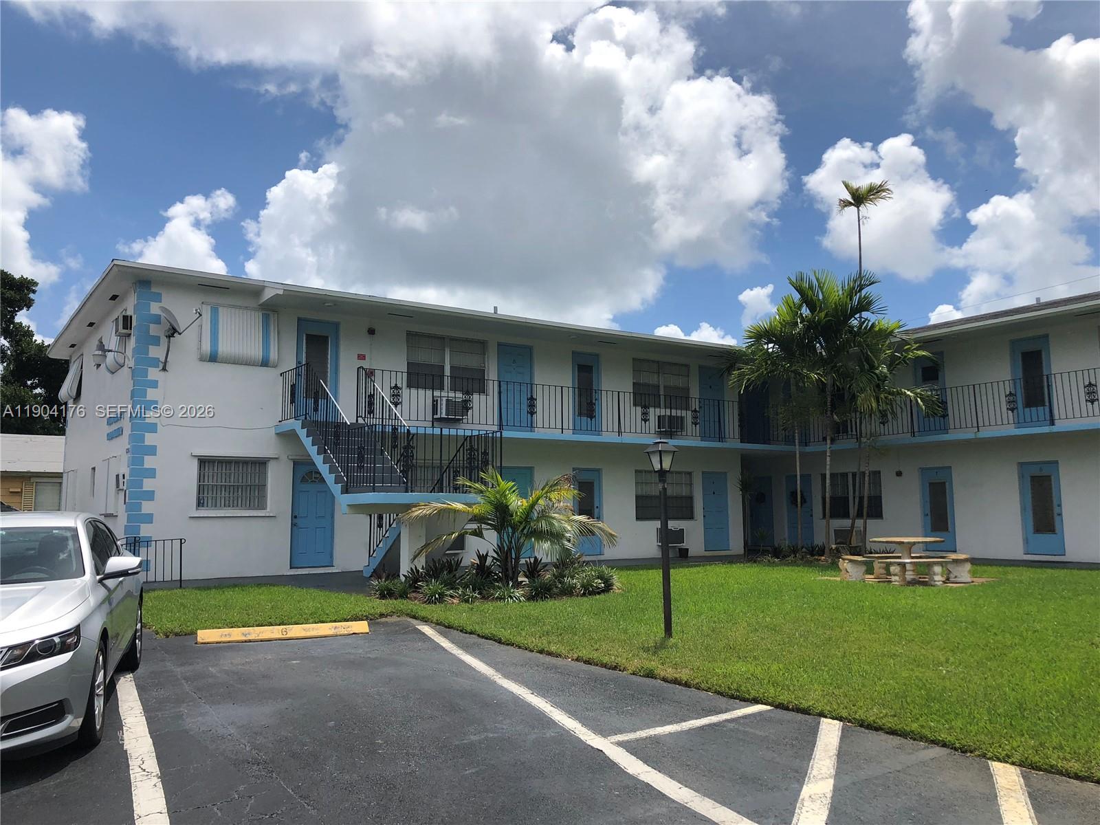 1836 Arthur Street, Unit 20 Hollywood, FL 33020 - Photo 3 of 19 a view of a house with a swimming pool and a yard