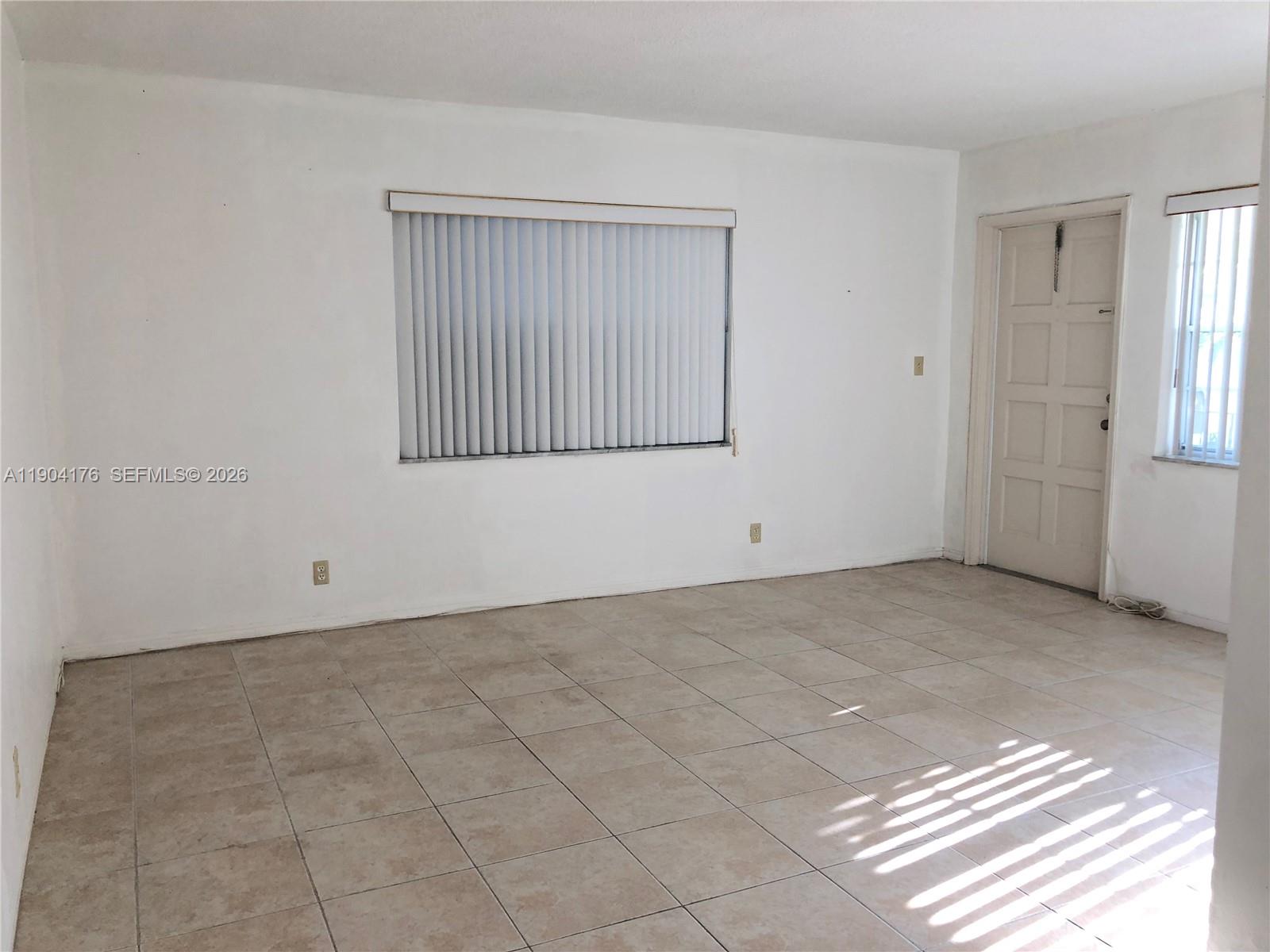 1836 Arthur Street, Unit 20 Hollywood, FL 33020 - Photo 5 of 19 a view of an empty room with a window