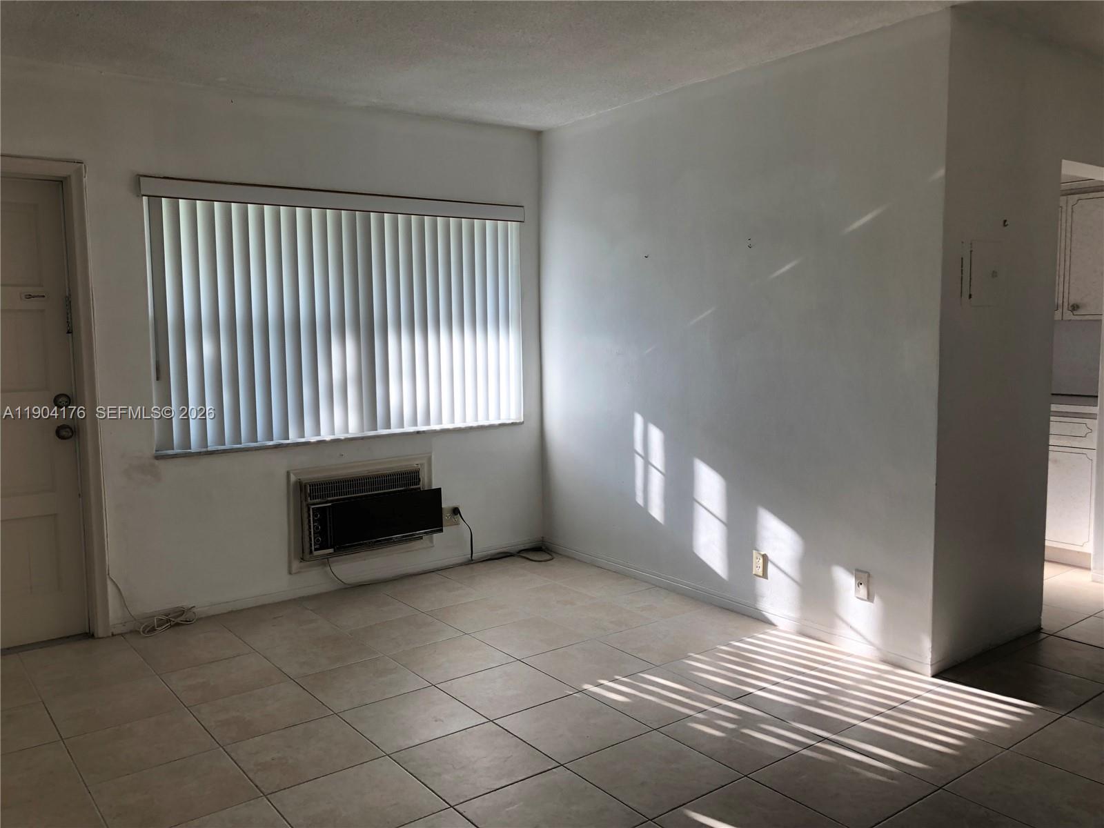 1836 Arthur Street, Unit 20 Hollywood, FL 33020 - Photo 7 of 19 a view of an empty room with a window