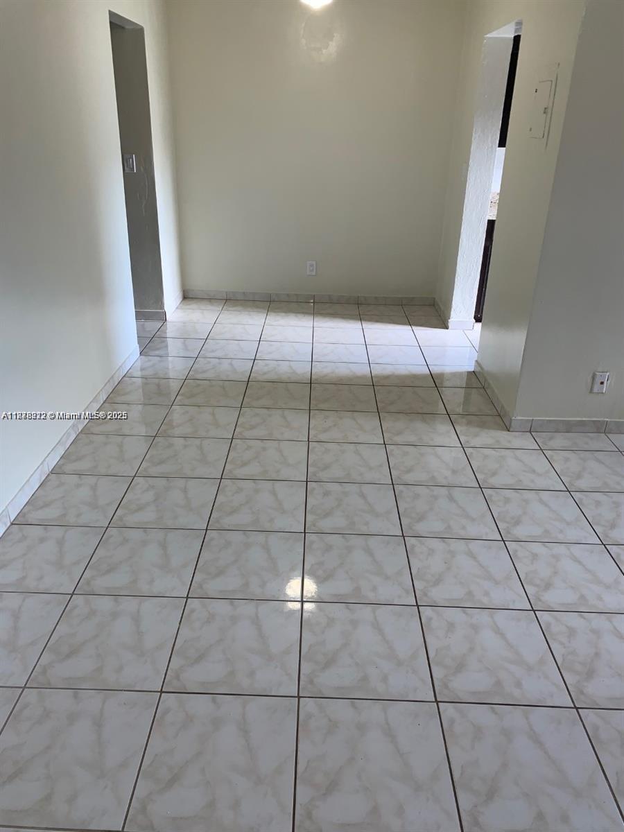 1850 Arthur Street, Unit 2 Hollywood, FL 33020 - Photo 11 of 20 a view of an empty room with white tiles