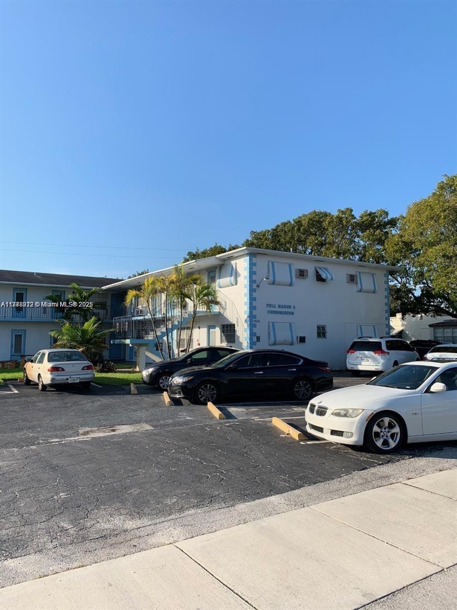 1850 Arthur Street, Unit 2 Hollywood, FL 33020 - Photo 17 of 20 a car parked in front of a house