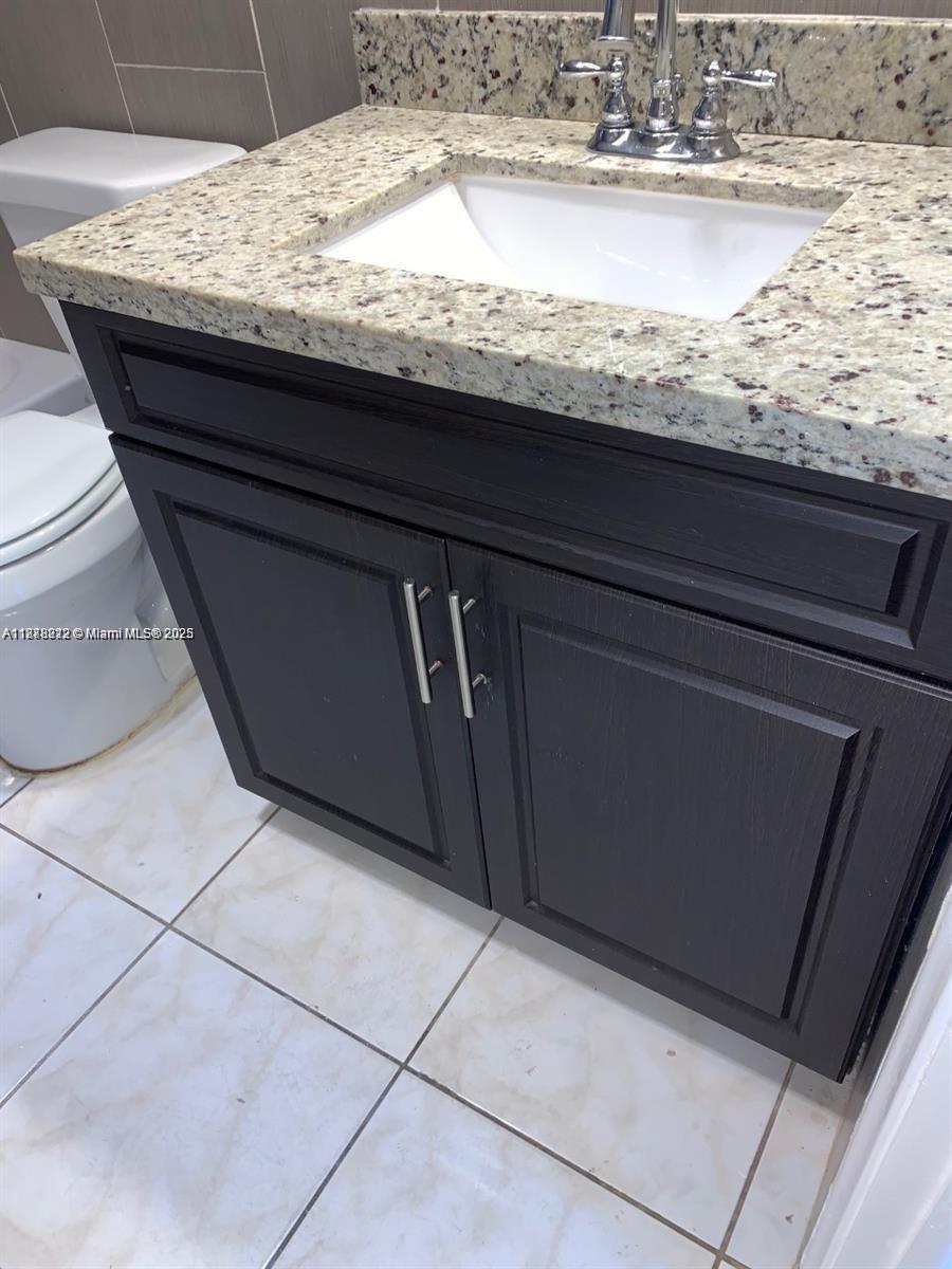 1850 Arthur Street, Unit 2 Hollywood, FL 33020 - Photo 7 of 20 a close view of sink and microwave