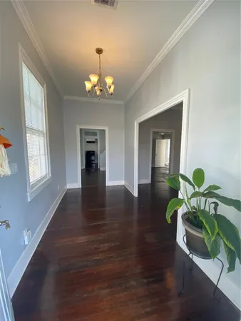 a view of a livingroom with furniture chandelier