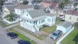 a view of balcony with wooden floor