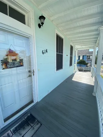 wooden floor in an empty room with a fireplace