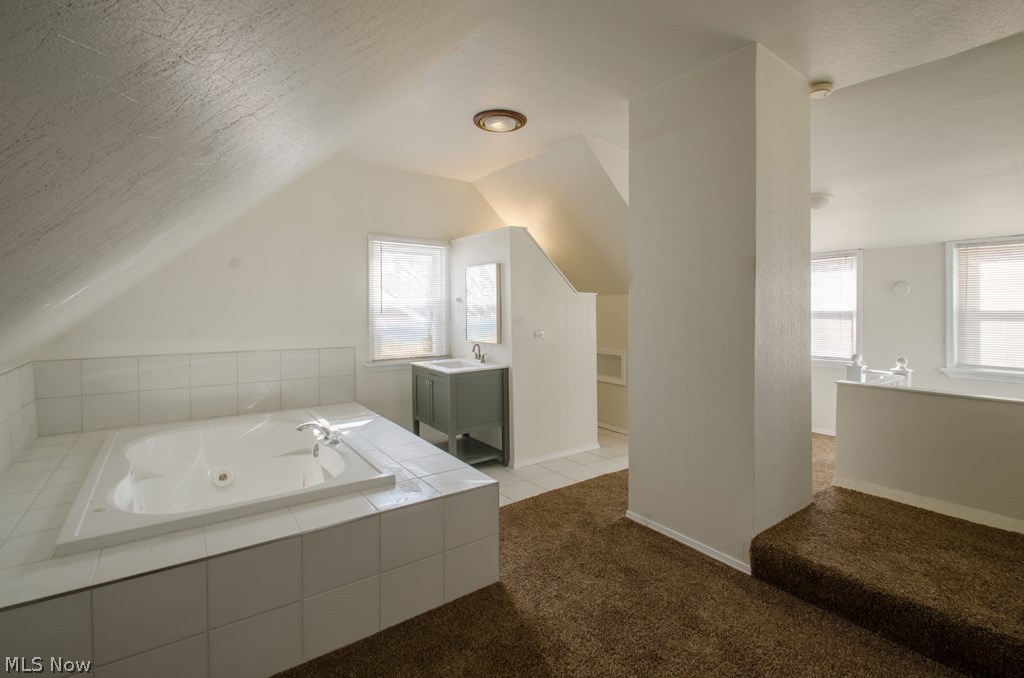 1366 Brookline Road Cleveland, OH 44121 - Photo 24 of 33 Master ensuite is open to the master bedroom w/large Jacuzzi newly installed shaker cabinet granite counter top private bathroom