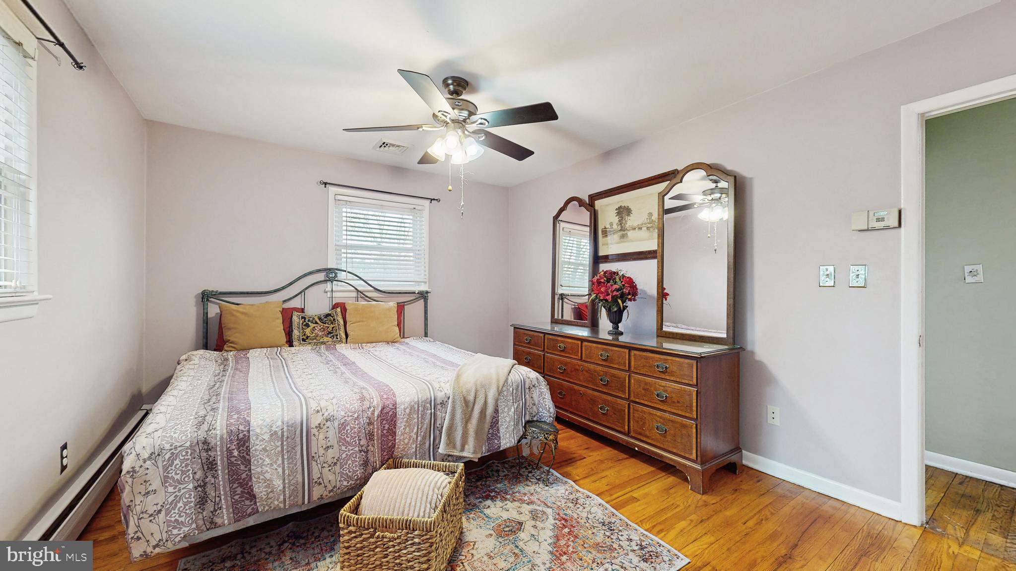 935 Bear Tavern Road Ewing, NJ 08628 - Photo 12 of 25 a bedroom with a bed and a mirror on the dresser