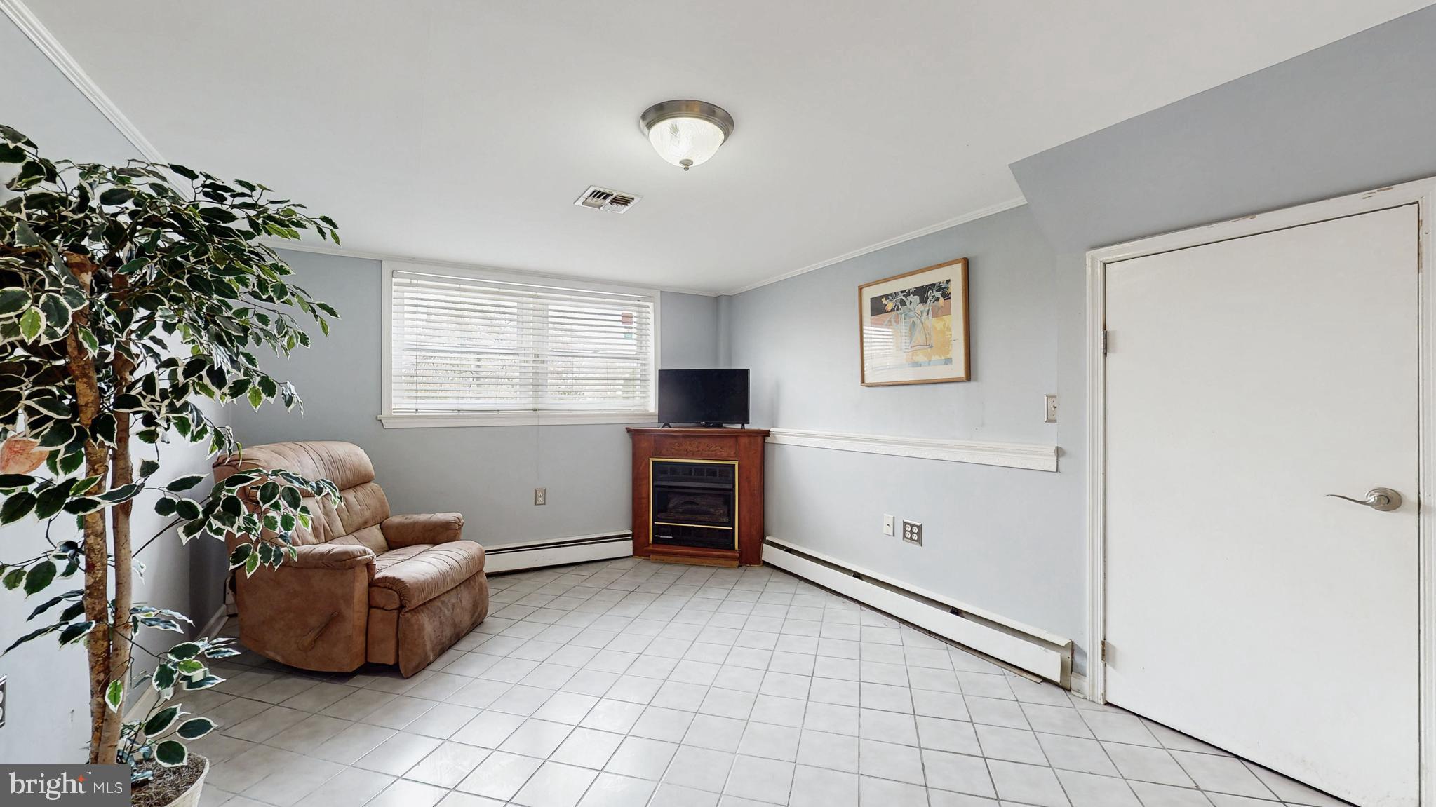 935 Bear Tavern Road Ewing, NJ 08628 - Photo 19 of 25 a living room with furniture and a window