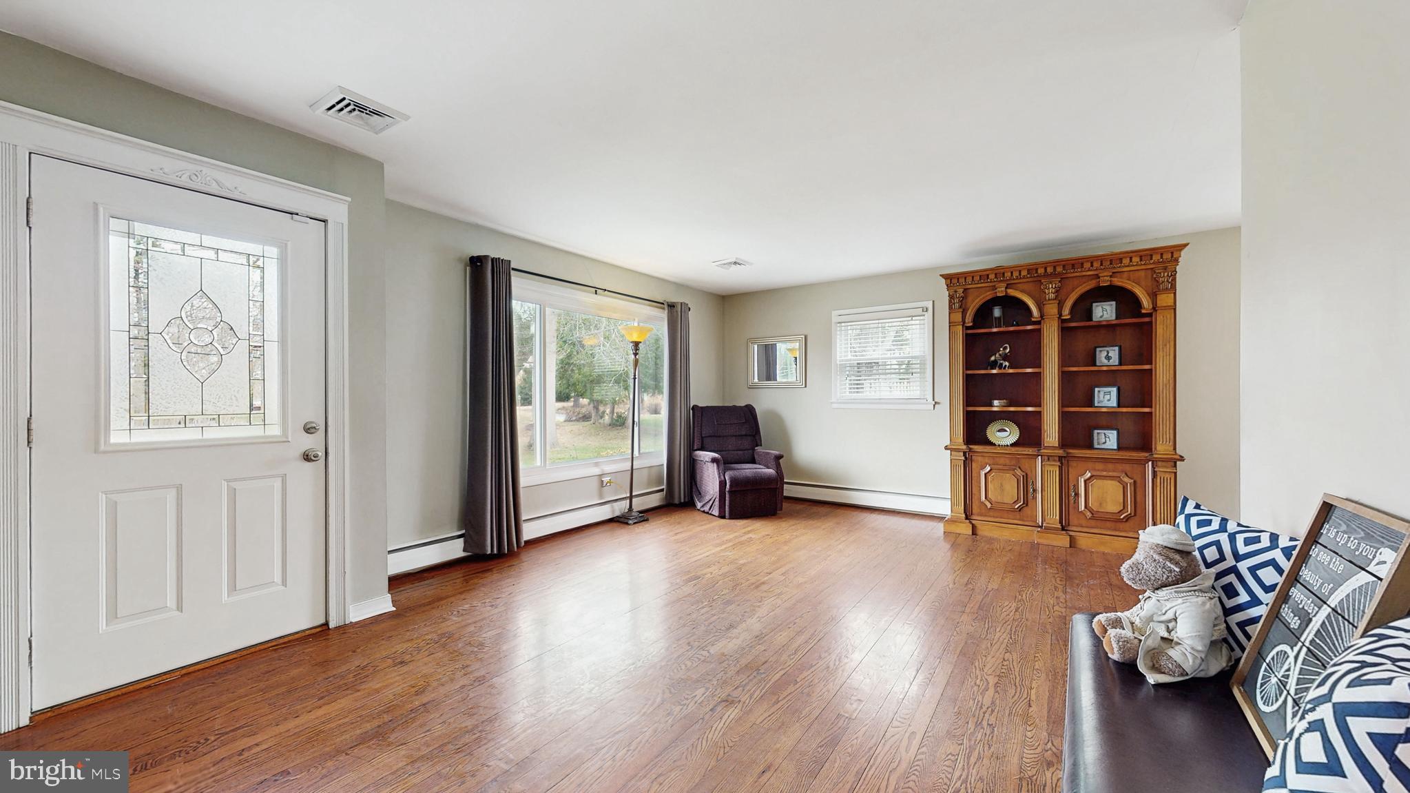 935 Bear Tavern Road Ewing, NJ 08628 - Photo 5 of 25 a view of a livingroom with furniture and wooden floor
