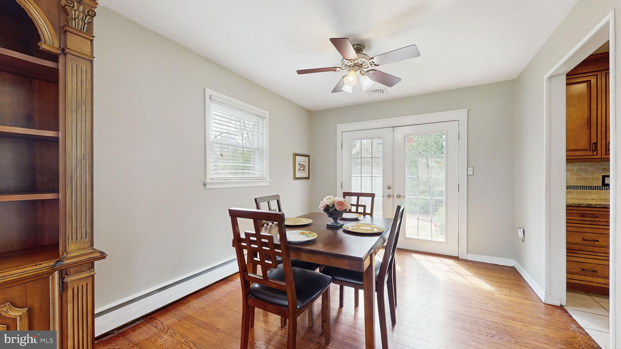 935 Bear Tavern Road Ewing, NJ 08628 - Photo 6 of 25 a view of a dining room with furniture and wooden floor