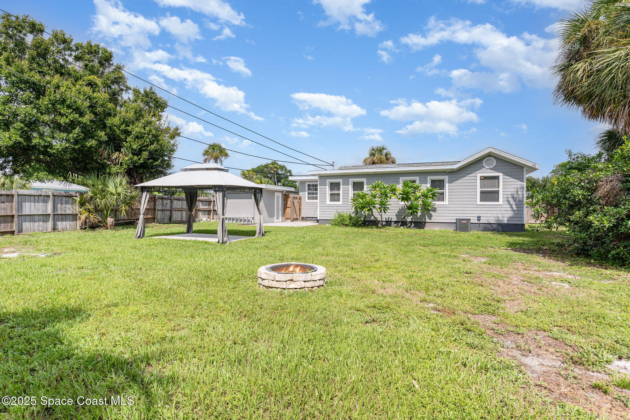 2566 Spence Drive Northeast Palm Bay, FL 32905 - Photo 19 of 20 a view of house with garden