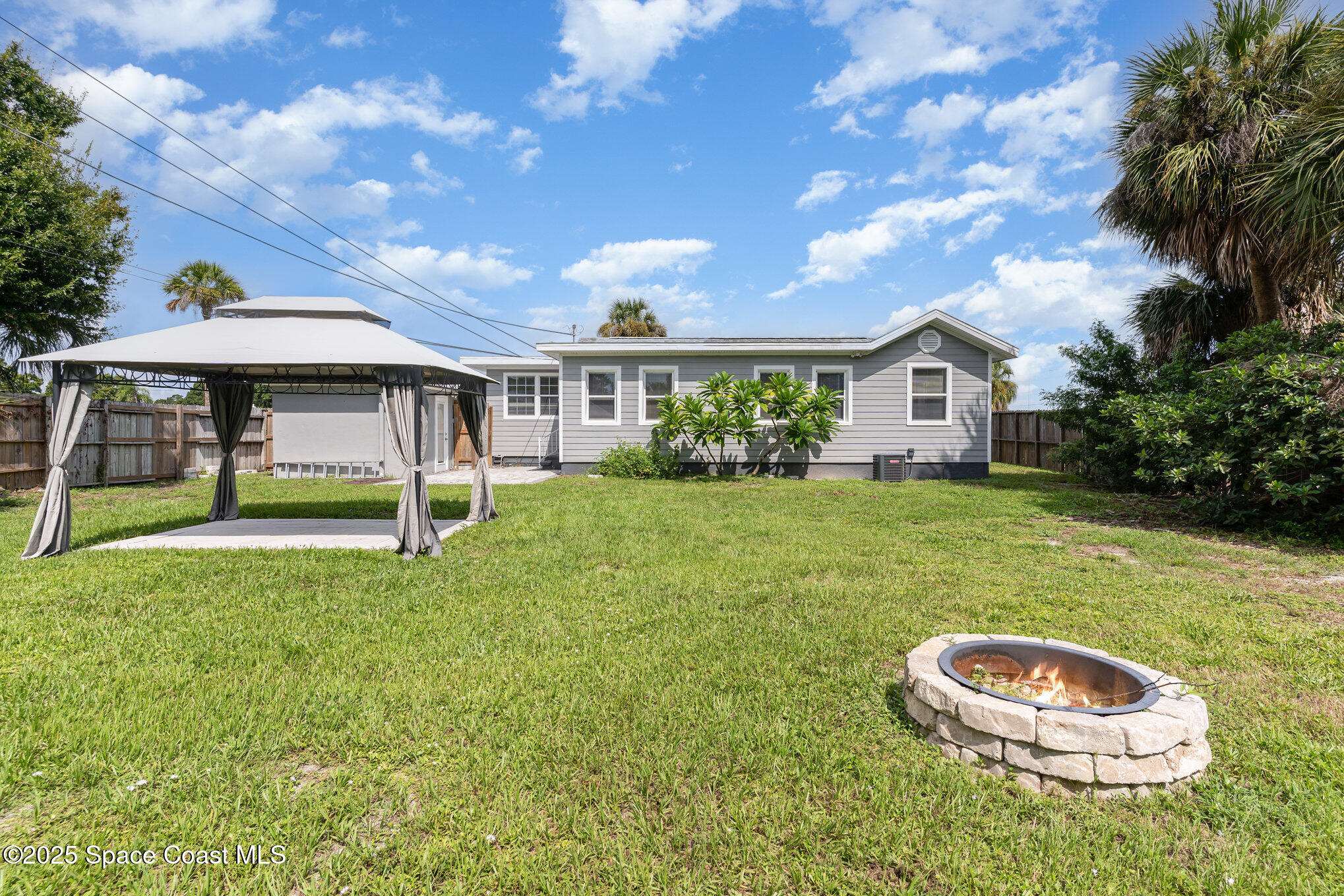 2566 Spence Drive Northeast Palm Bay, FL 32905 - Photo 20 of 20 a house view with a garden space