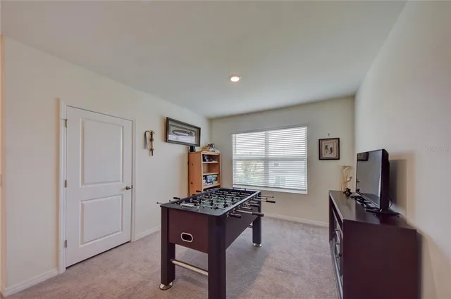 a room with furniture window and a flat screen tv