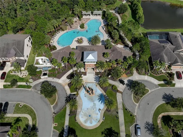 an aerial view of multi story residential houses with outdoor space