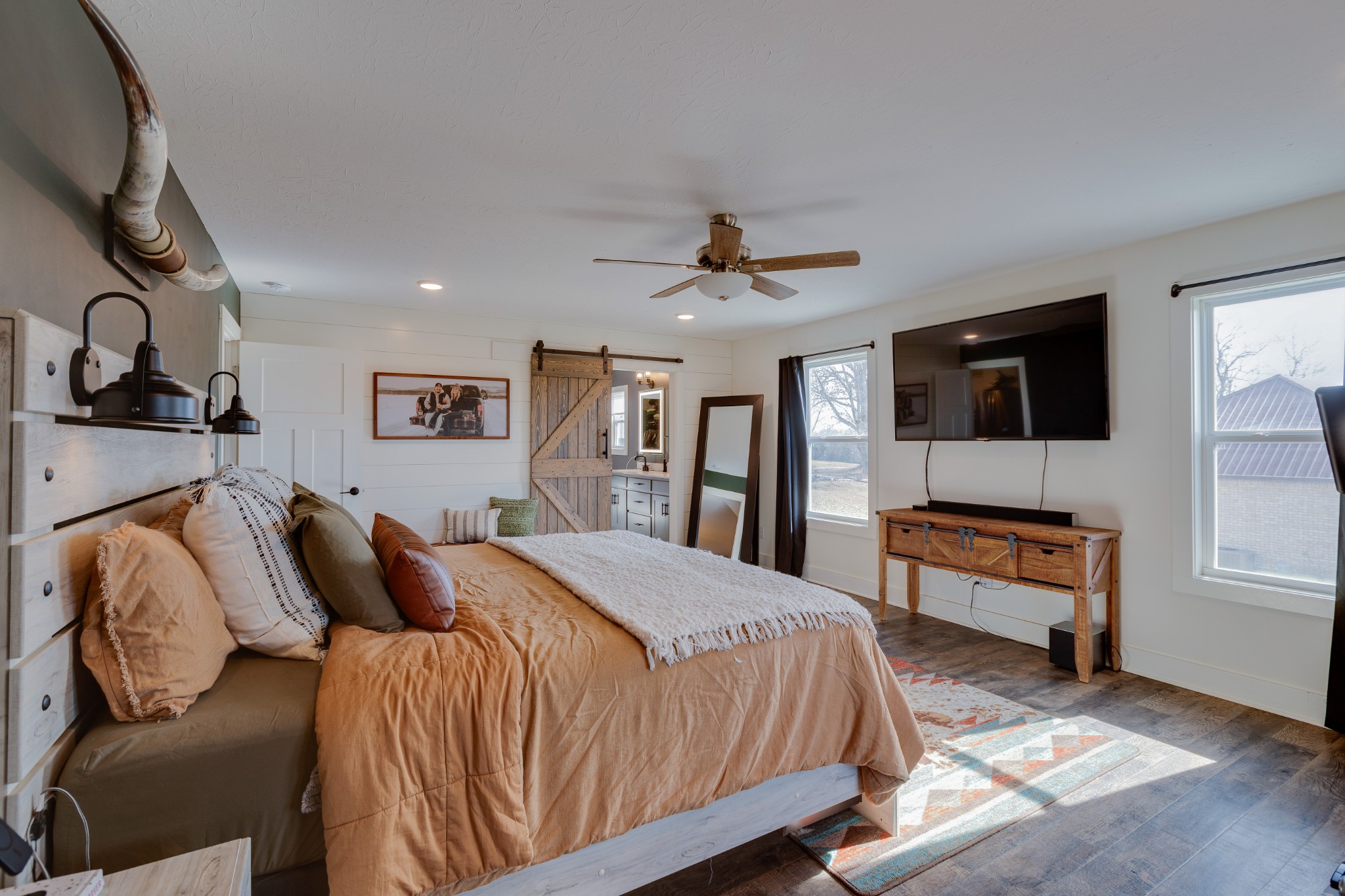 500 Armstrong Road Castalian Springs, TN 37031 - Photo 16 of 35 a spacious bedroom with a bed and a flat screen tv