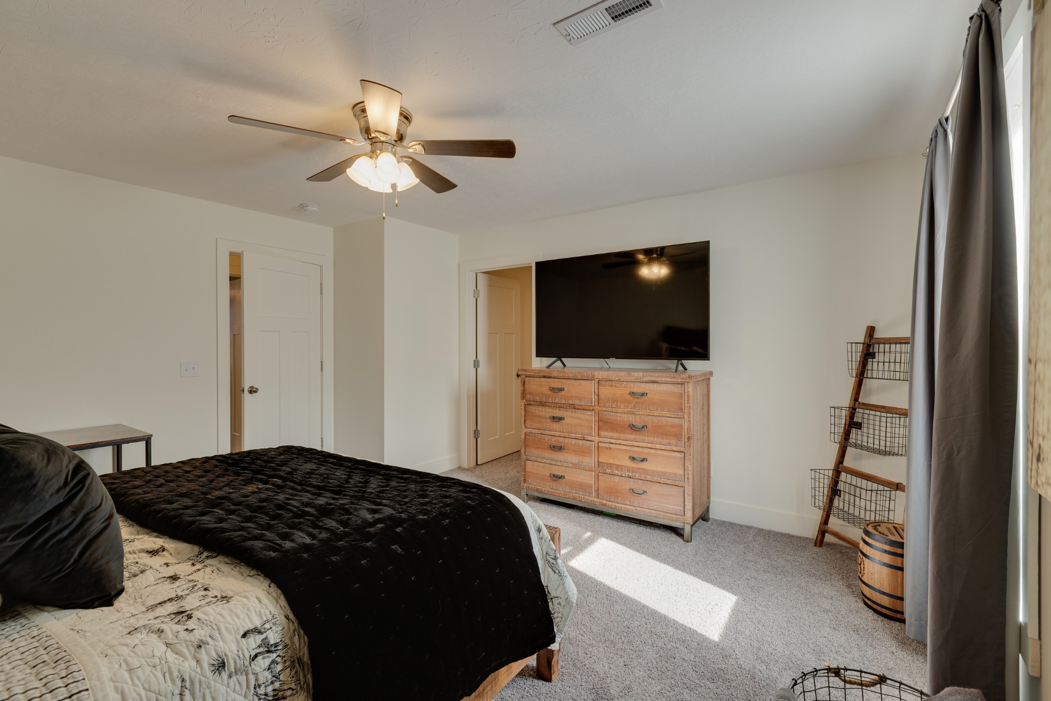 500 Armstrong Road Castalian Springs, TN 37031 - Photo 28 of 35 a bedroom with a bed and a flat tv screen on dresser