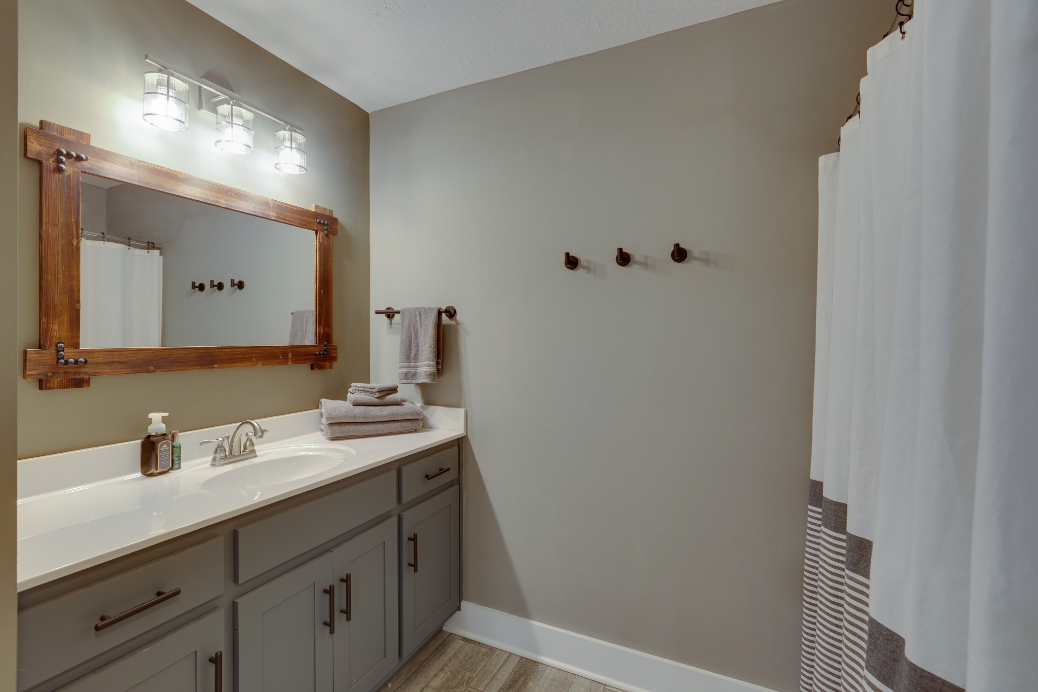 500 Armstrong Road Castalian Springs, TN 37031 - Photo 34 of 35 a bathroom with a sink a vanity and a mirror