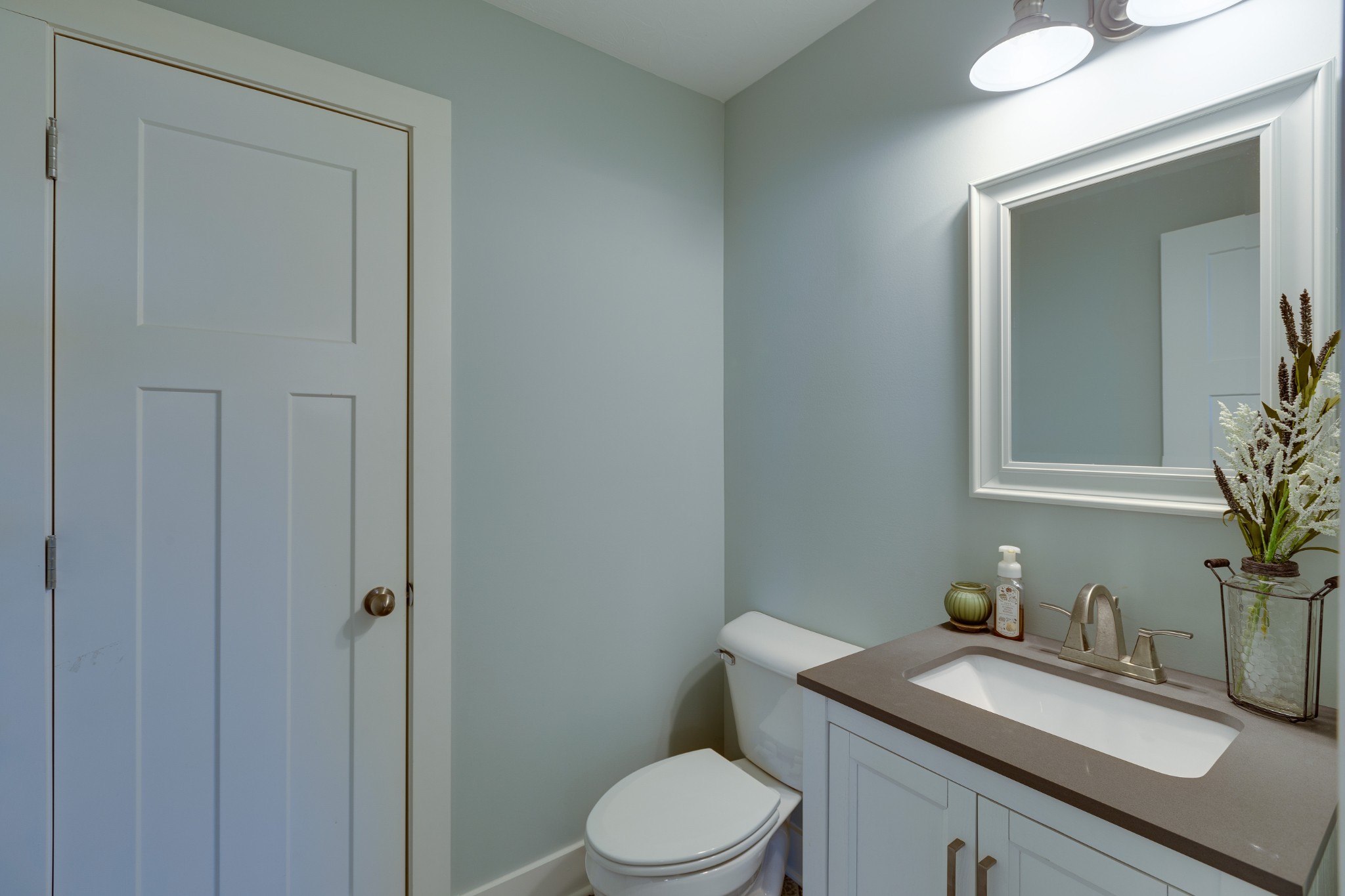 500 Armstrong Road Castalian Springs, TN 37031 - Photo 35 of 35 a bathroom with a granite countertop toilet sink and mirror