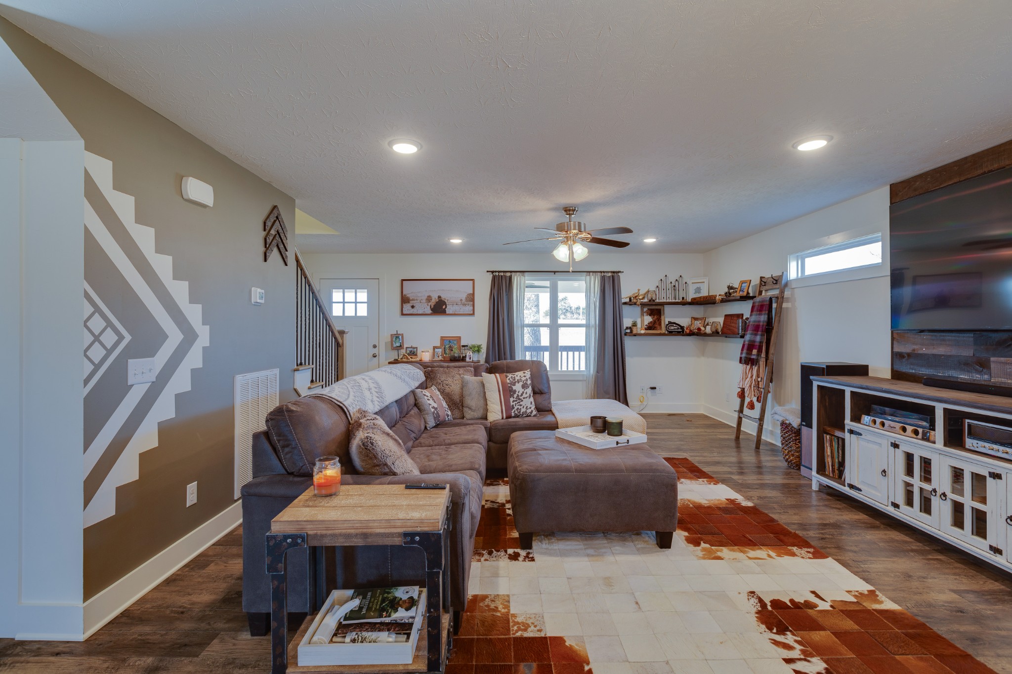 500 Armstrong Road Castalian Springs, TN 37031 - Photo 7 of 35 a living room with furniture and a flat screen tv