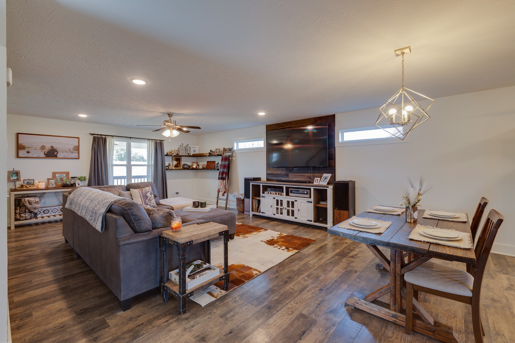 500 Armstrong Road Castalian Springs, TN 37031 - Photo 8 of 35 a living room with furniture and a flat screen tv