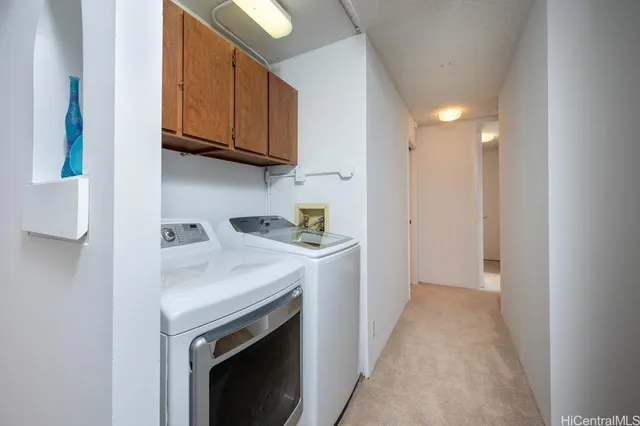 a view of a kitchen with electric appliances