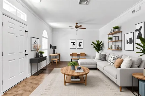 an empty room with wooden floor chandelier fan and windows