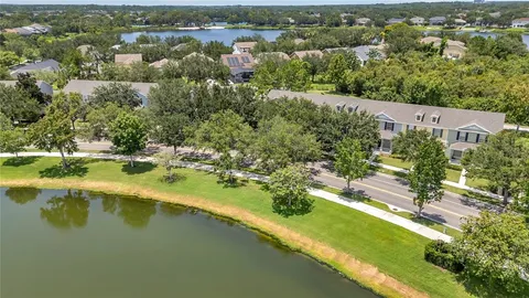 an aerial view of a house with a lake view