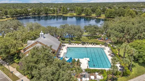an aerial view of a house with a lake view