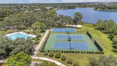 an aerial view of a house with a lake view