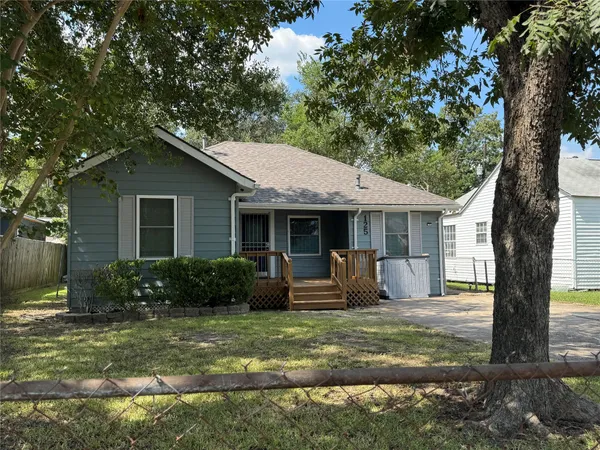a front view of a house with garden and porch