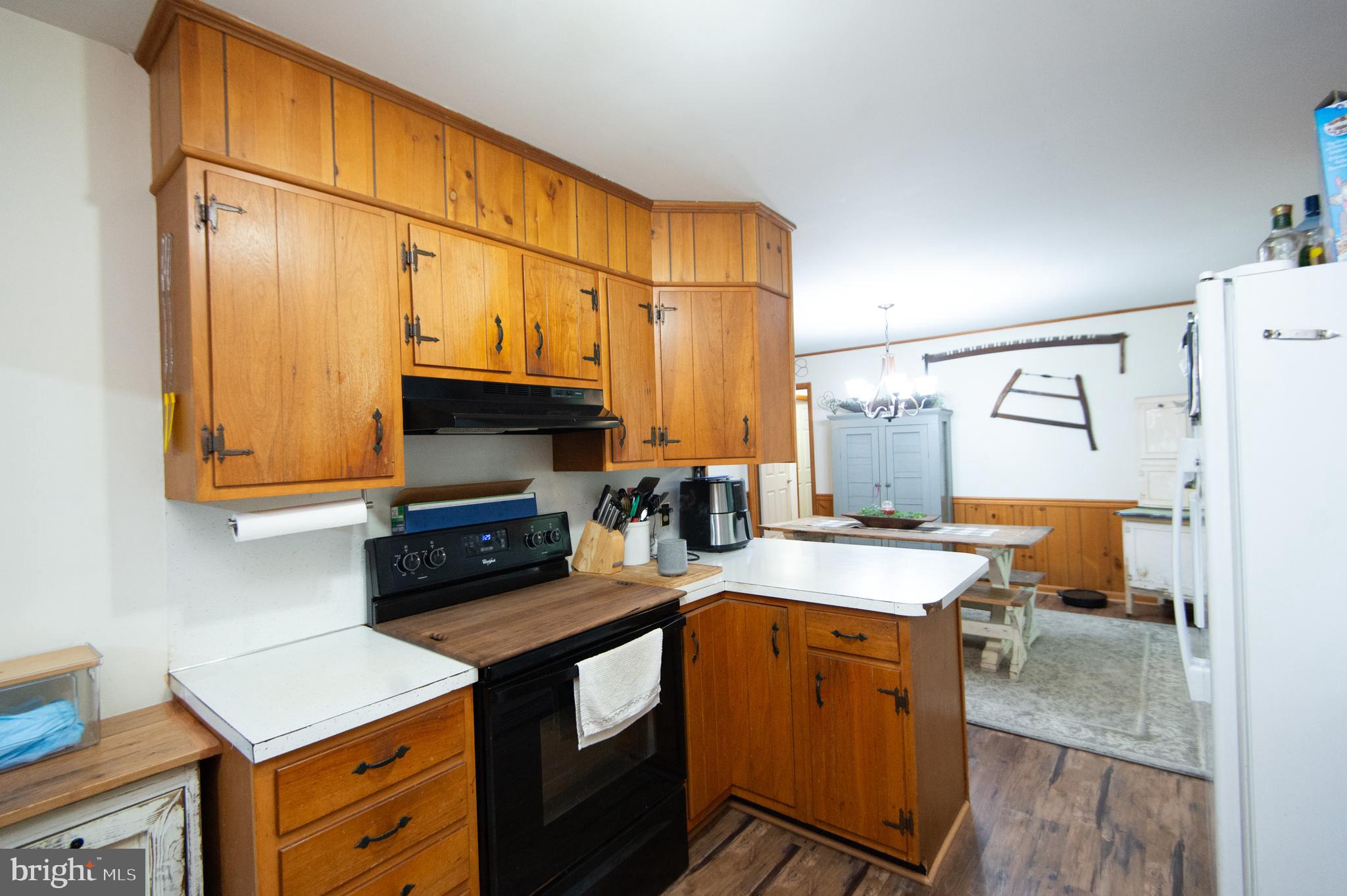 5802 Phyllis Drive Hurlock, MD 21643 - Photo 12 of 26 a kitchen with stainless steel appliances granite countertop a sink a stove and a refrigerator