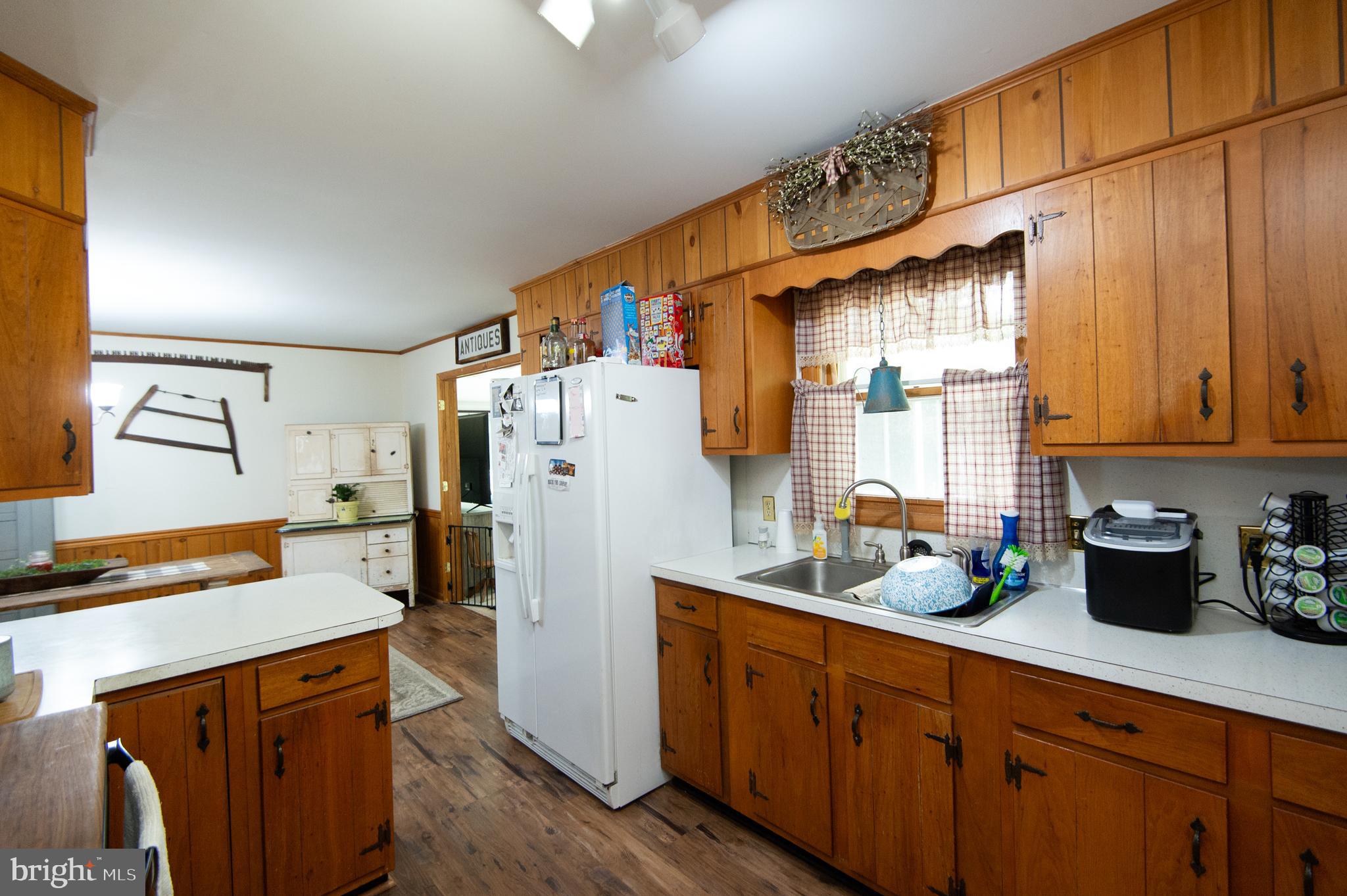 5802 Phyllis Drive Hurlock, MD 21643 - Photo 13 of 26 a kitchen with stainless steel appliances a refrigerator a sink a stove and cabinets