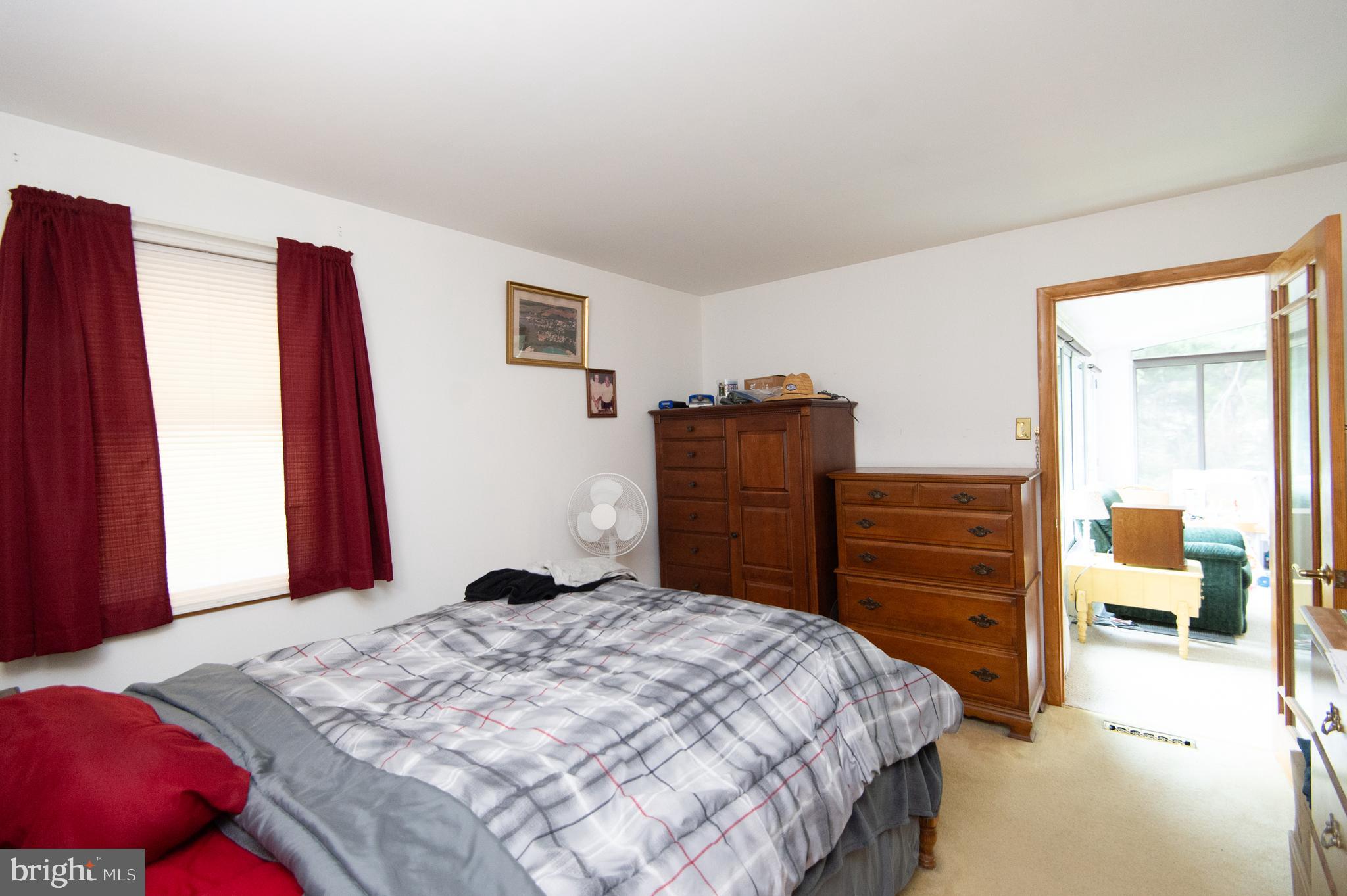 5802 Phyllis Drive Hurlock, MD 21643 - Photo 14 of 26 a bedroom with a bed and a closet