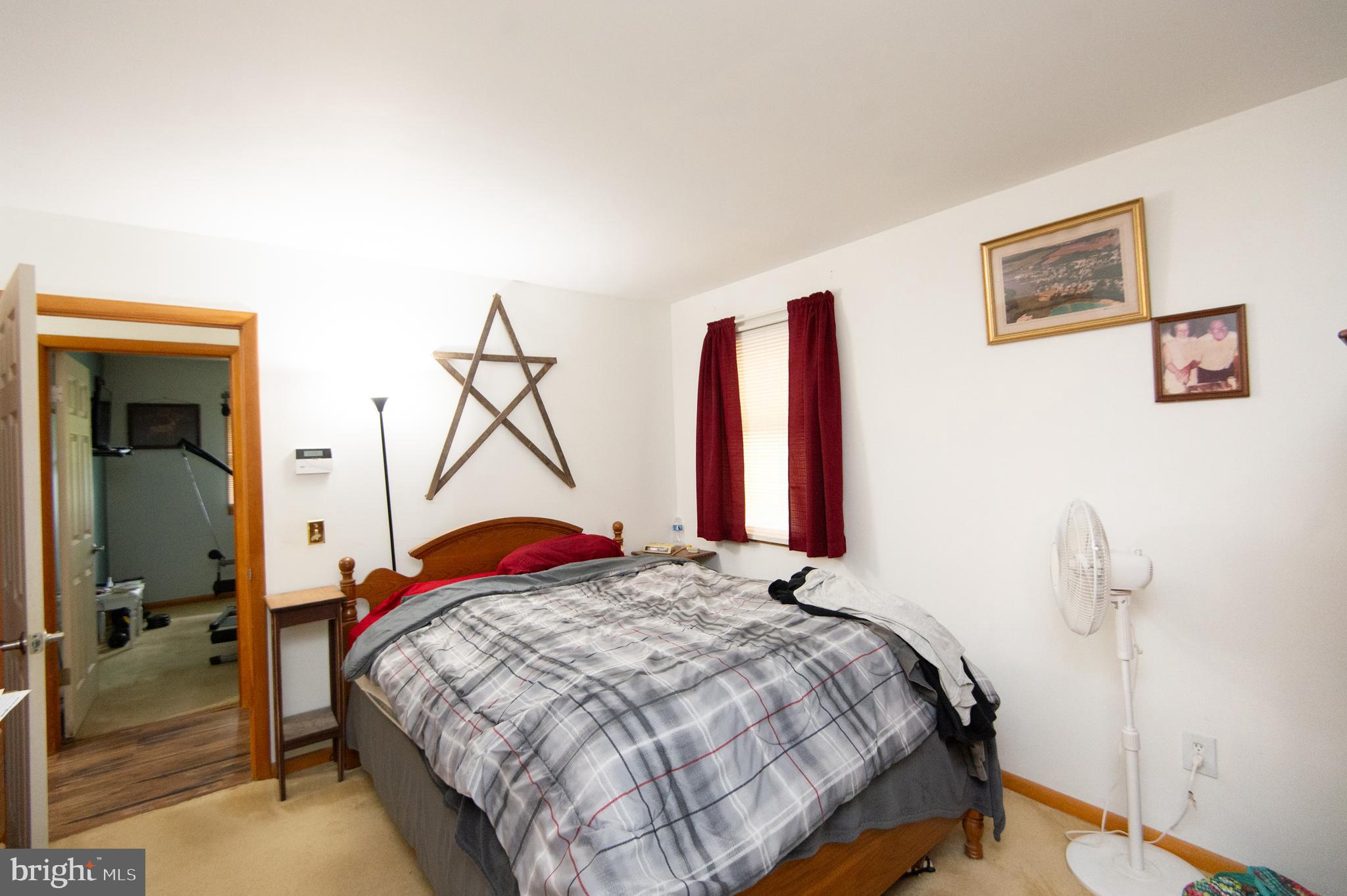 5802 Phyllis Drive Hurlock, MD 21643 - Photo 15 of 26 a bedroom with a bed and a closet