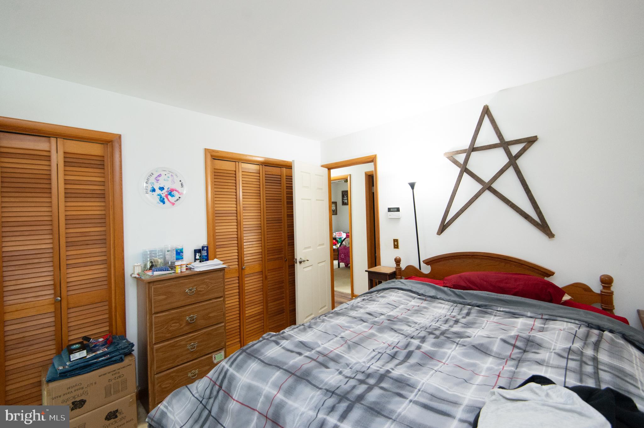 5802 Phyllis Drive Hurlock, MD 21643 - Photo 16 of 26 a bedroom with a bed and a closet