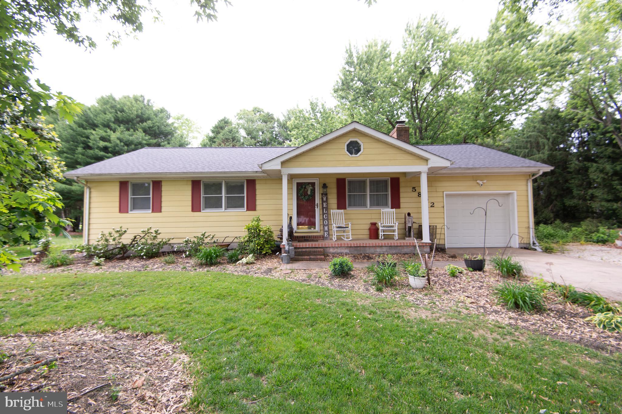 5802 Phyllis Drive Hurlock, MD 21643 - Photo 20 of 26 a front view of a house with yard patio and green space