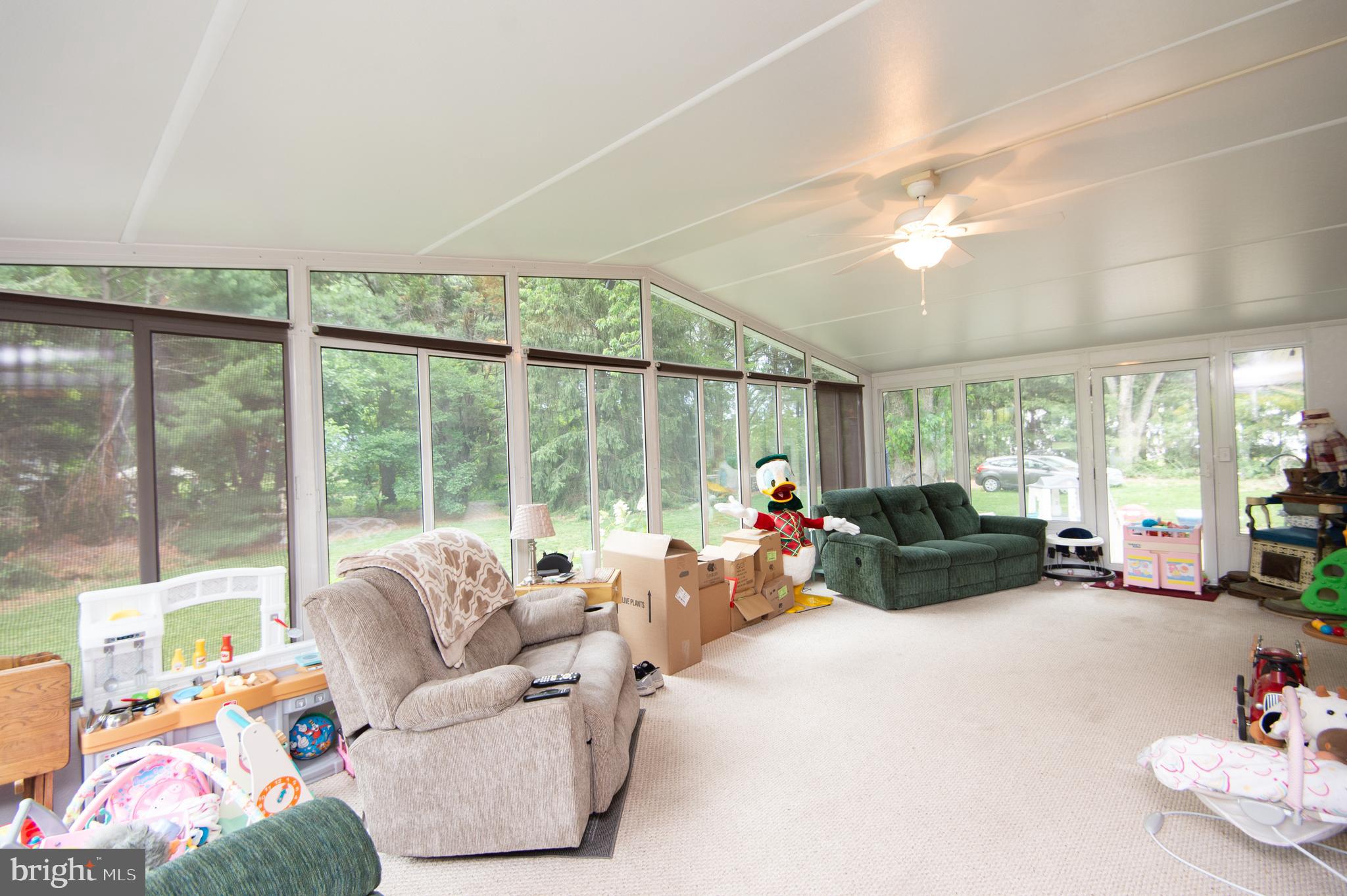 5802 Phyllis Drive Hurlock, MD 21643 - Photo 2 of 26 a living room with furniture and a large window