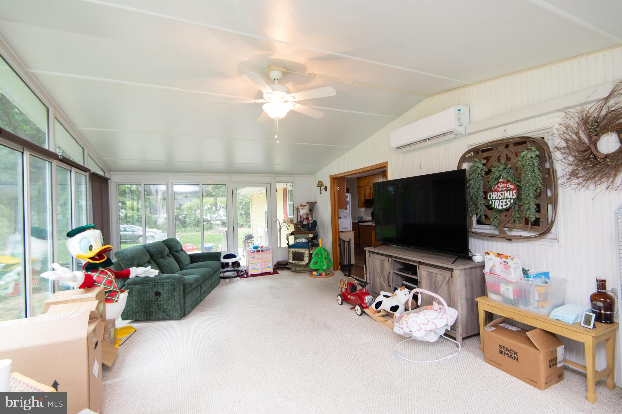 5802 Phyllis Drive Hurlock, MD 21643 - Photo 3 of 26 a living room with furniture and a flat screen tv
