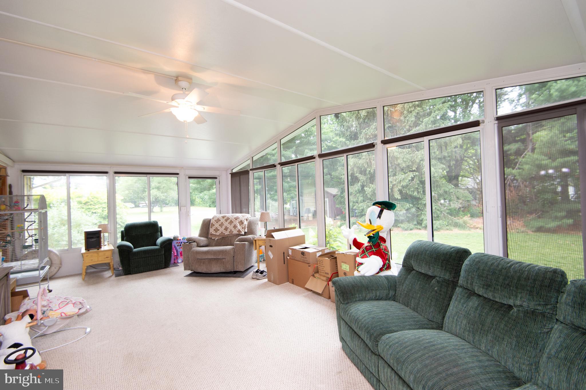 5802 Phyllis Drive Hurlock, MD 21643 - Photo 4 of 26 a living room with furniture and a large window